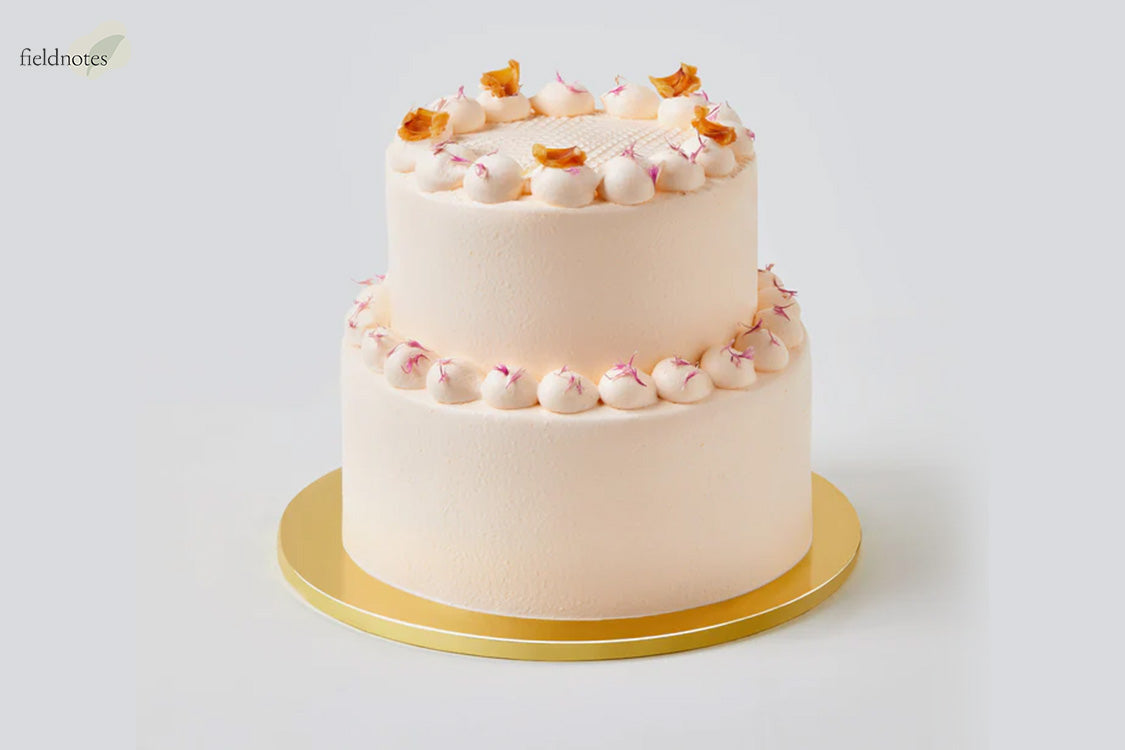 Fieldnotes two-tier cream cake for expressing heartfelt emotions.