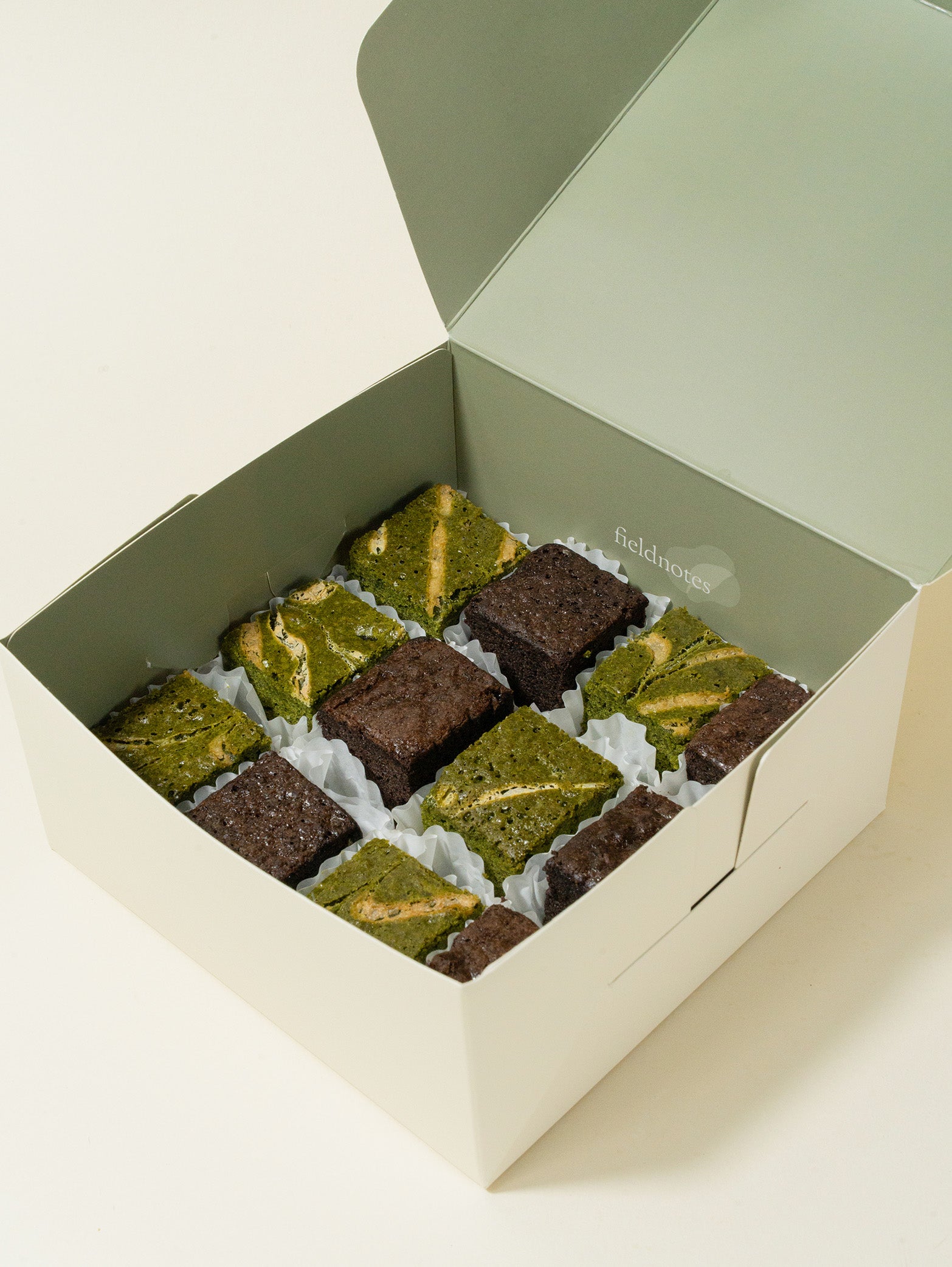 A box of assorted matcha and chocolate brownies in bite size, available for online order in Singapore