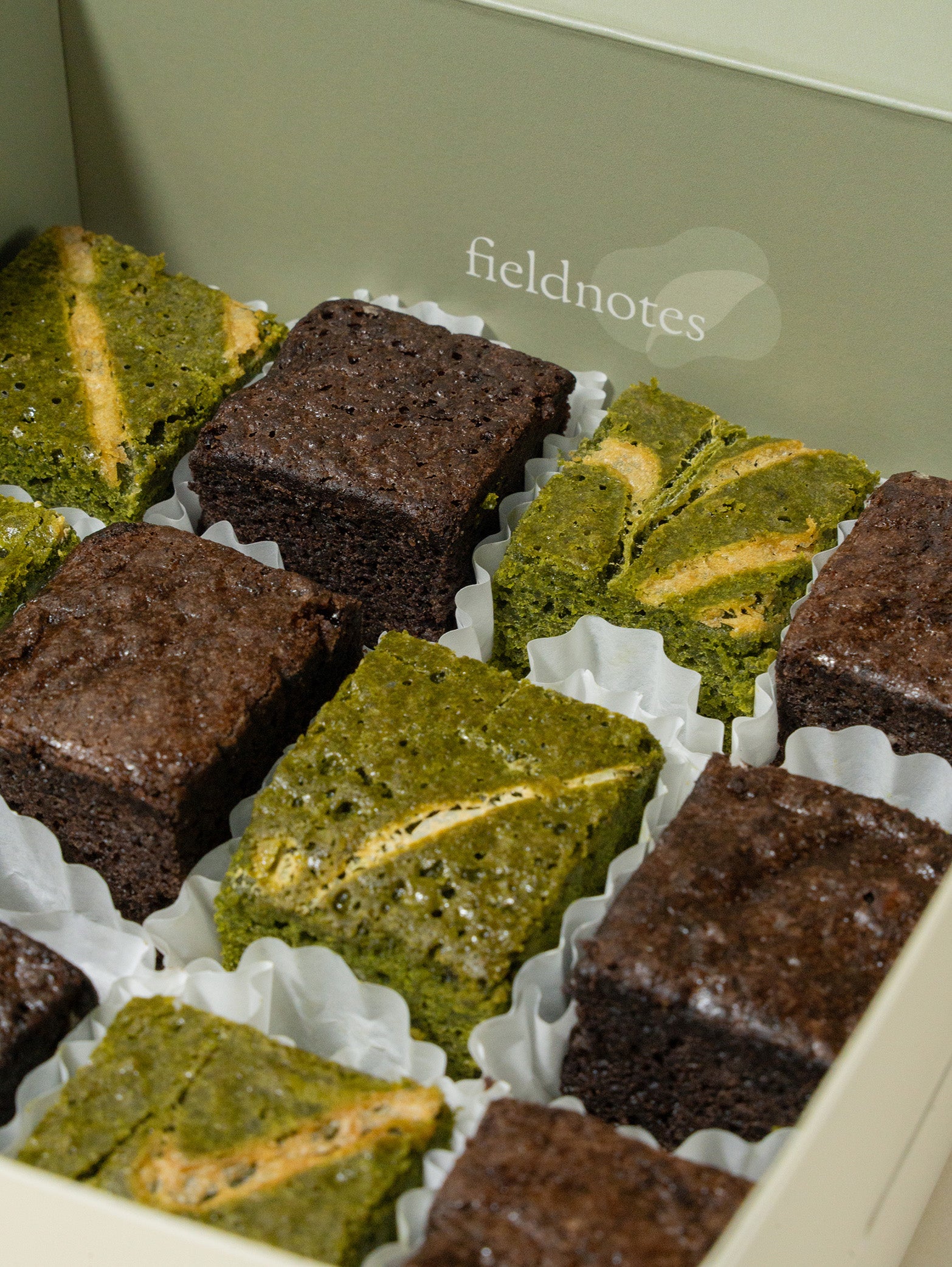 A box of assorted matcha and chocolate brownies in bite size, available for online order in Singapore