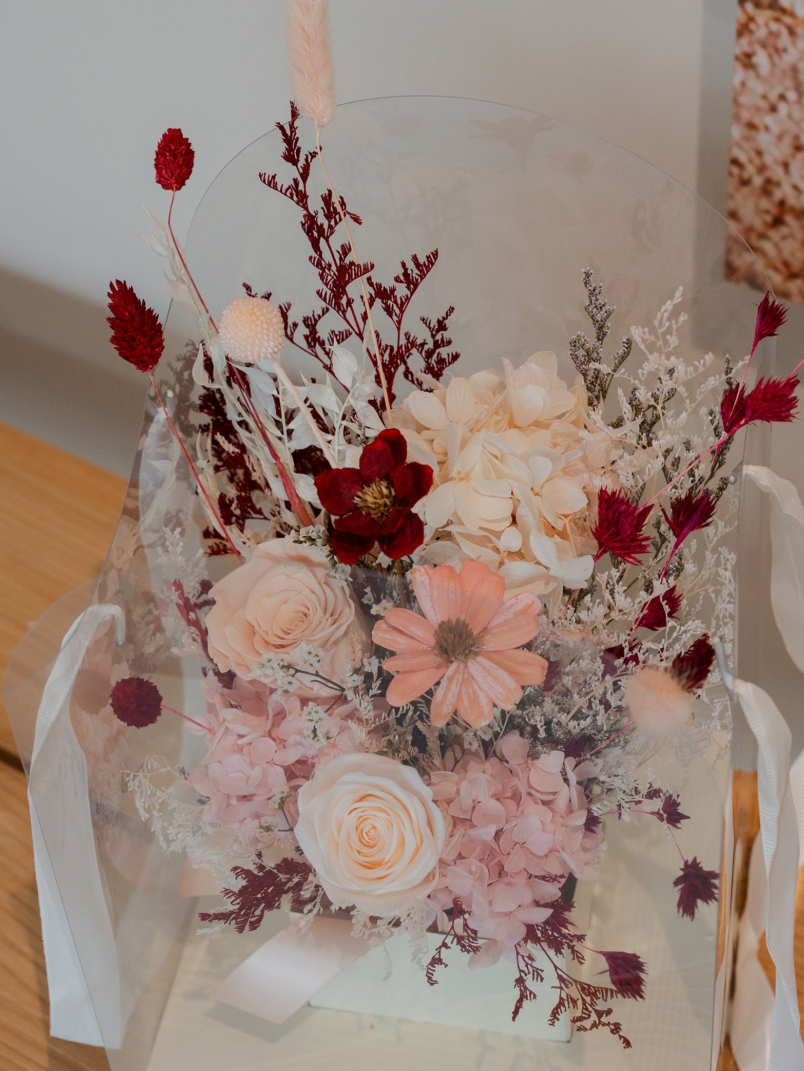A preserved floral bouquet featuring roses and a mix of dried blooms, available for online order for islandwide delivery in Singapore