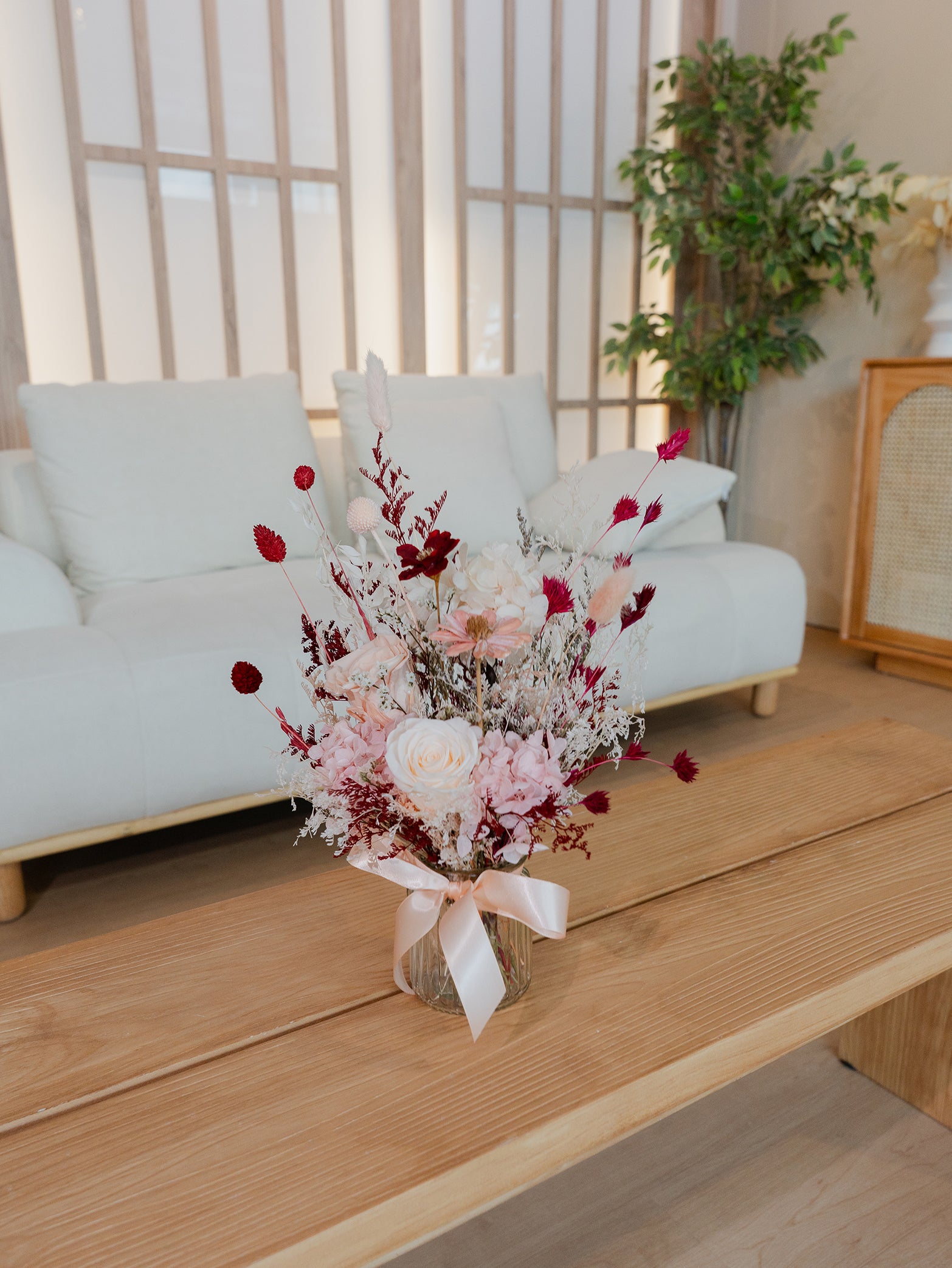 A preserved floral bouquet featuring roses and a mix of dried blooms, available for online order for islandwide delivery in Singapore