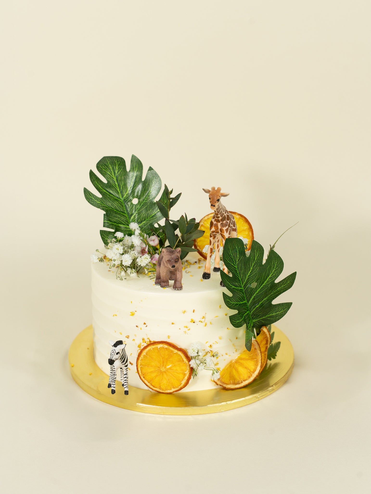 One tier celebration rustic safari cake decorated with fruits and animals, available for online delivery in Singapore