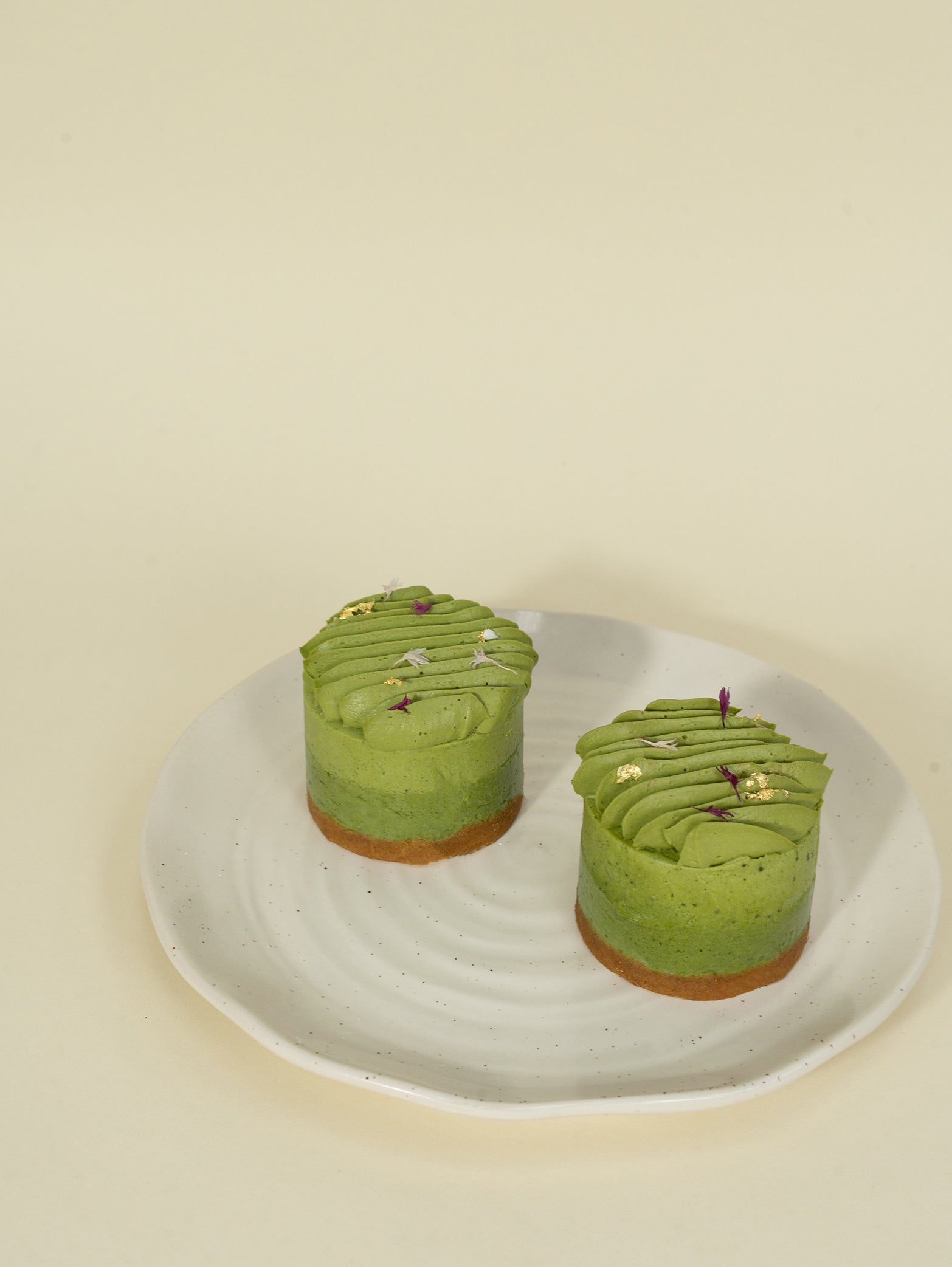 Uji creamy matcha cheesecake adorned with gold leaf, available for online order for delivery in Singapore