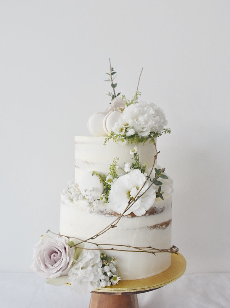 White flowers with twigs semi frosted cake -zeeandelle