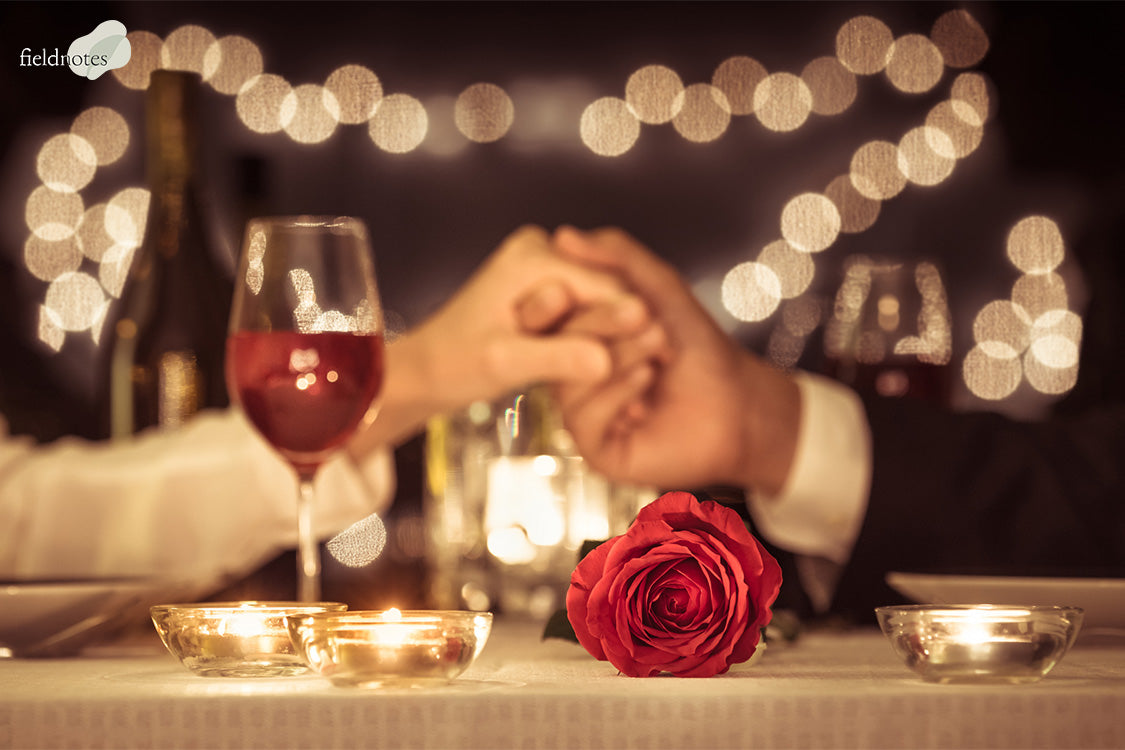 Couple holding their hands over a table