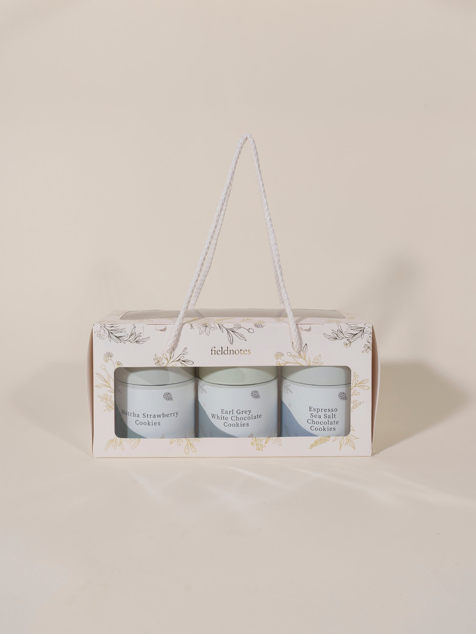 Fieldnotes’ Days of Wonder Cookies Set in a gift box with string handle includes jars of handcrafted cookies and birthday cake tarts.