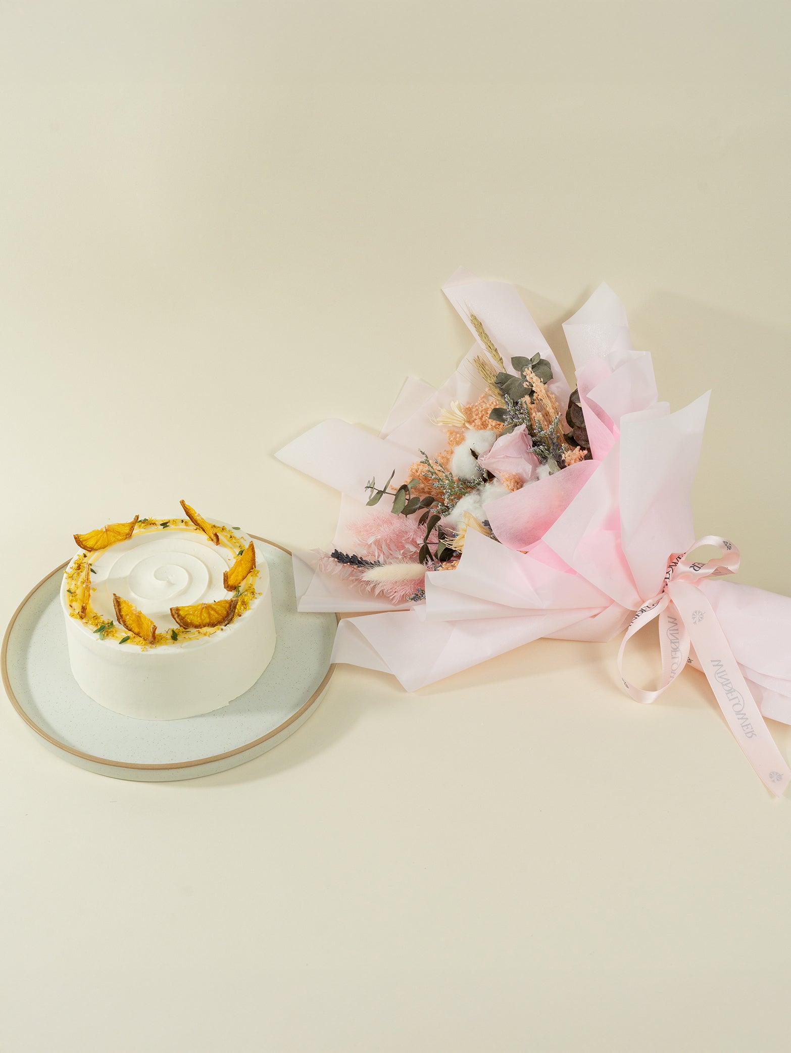 Cake paired with flower bouquet of preserved flowers, available for online delivery in Singapore