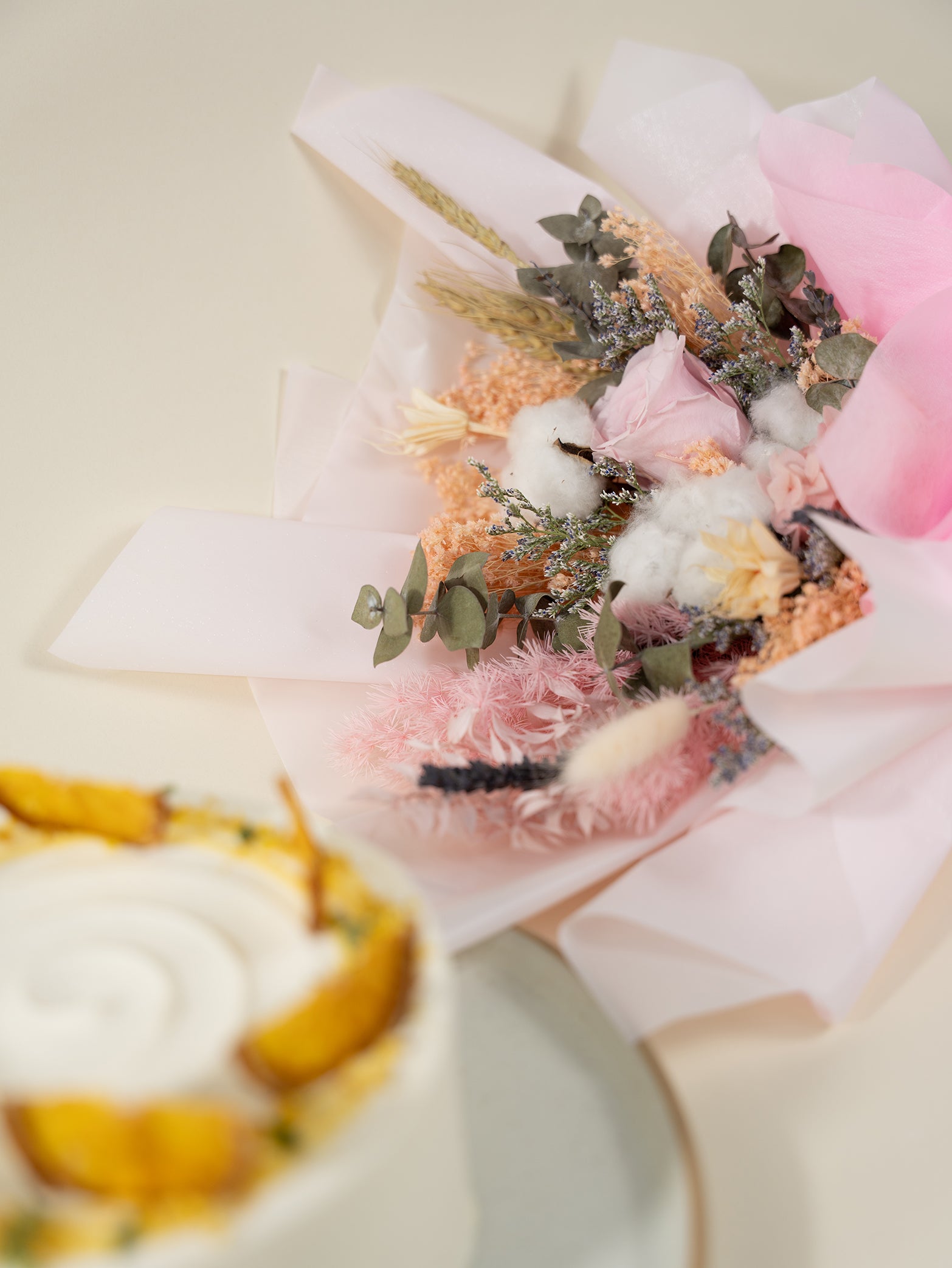 Cake paired with flower bouquet of preserved flowers, available for online delivery in Singapore