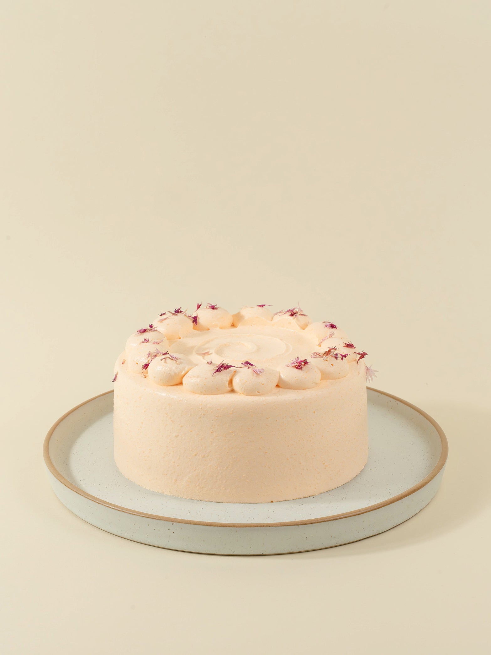 The fieldnotes Melon Lychee Cream birthday cake features pale pink frosting, piped cream, and pink petals. Tart-like, next day delivery.