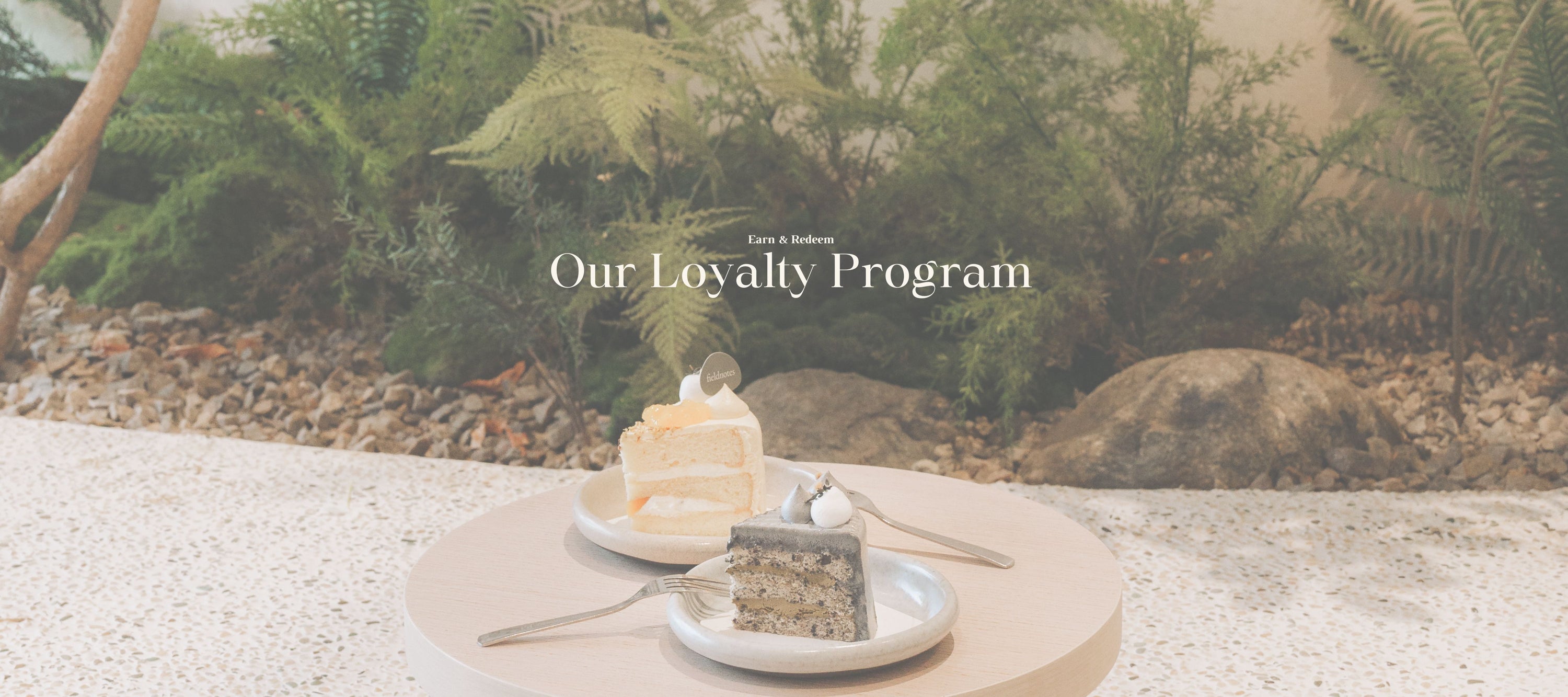 Loyalty program Banner from fieldnotes with 2 Ckae slices on a table 