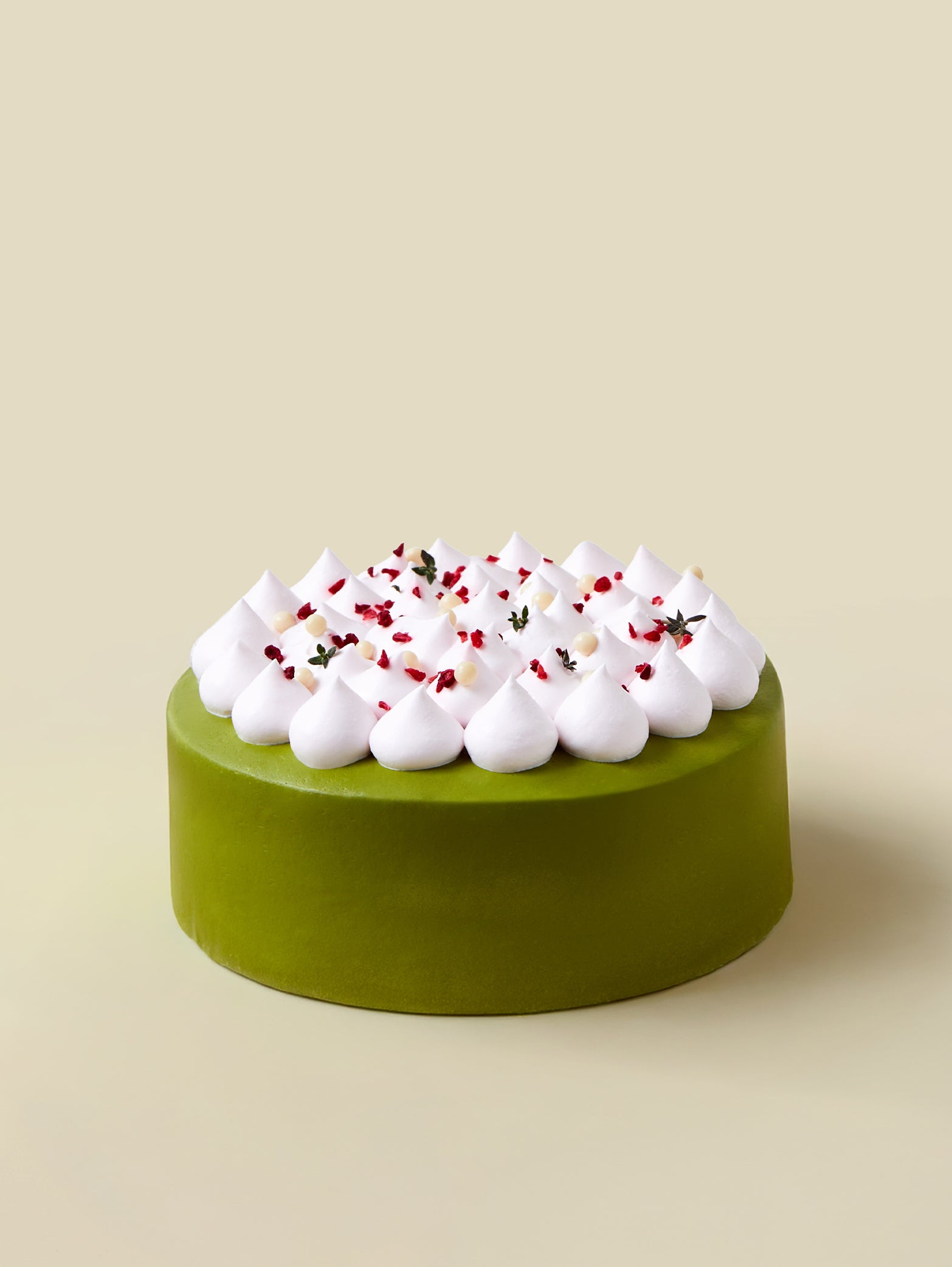 The fieldnotes Uji Matcha Strawberry is a round, tart-like matcha sponge cake, birthday cake-style, with cream and strawberries on top.