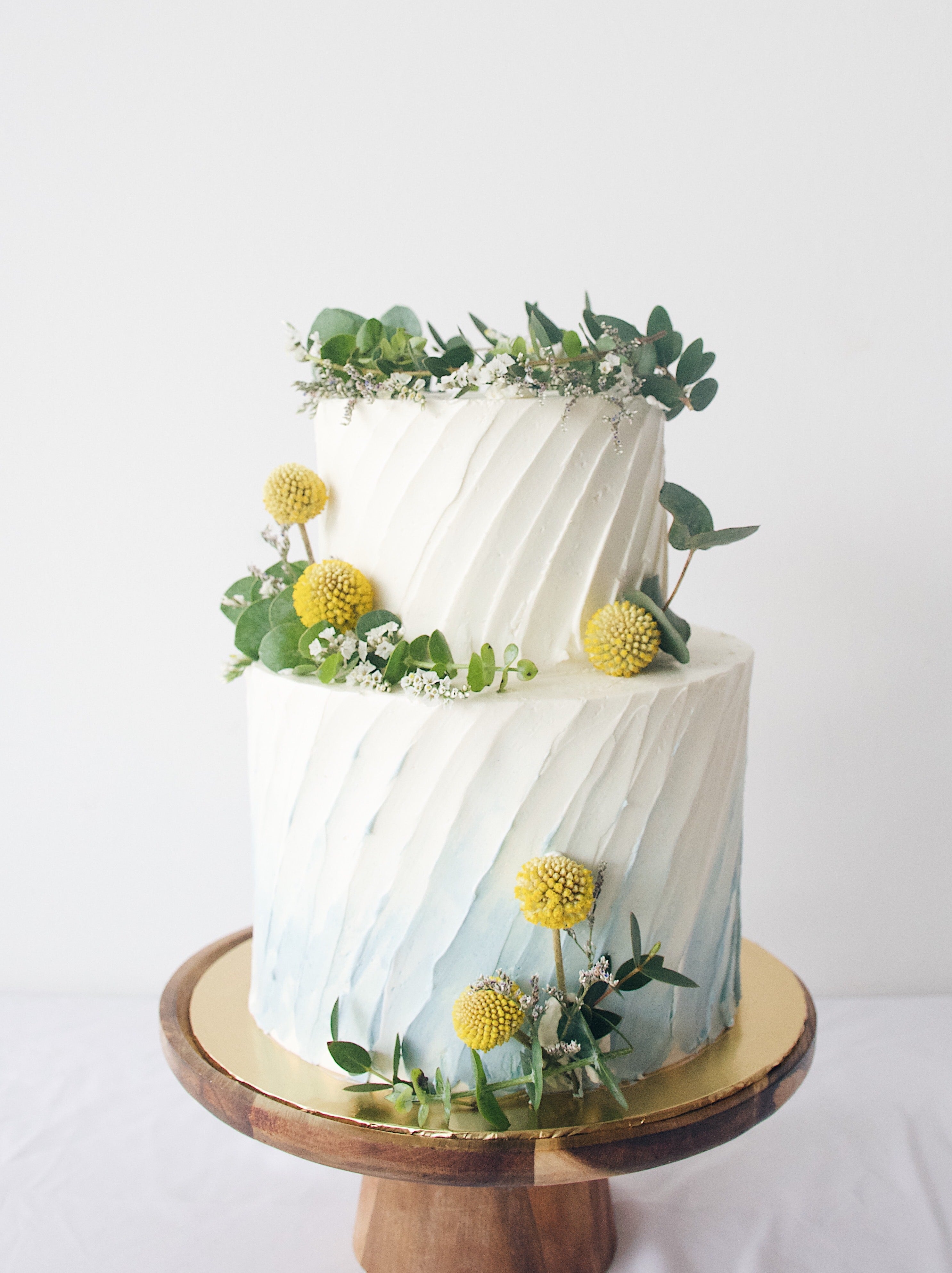 Blue & yellow garden wreath rustic birthday cake- zeeandelle